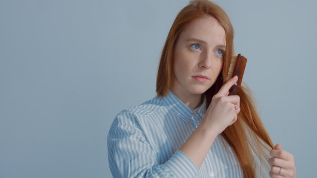 Gingerhead red hair ginger hair model with blue eyes on blue background