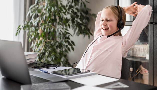 Free photo girl being happy after finishing her online class