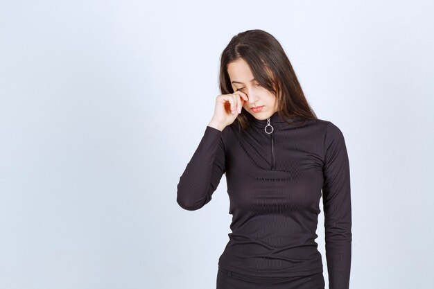 Free photo girl in black clothes looks sad and depressed.