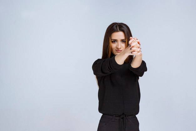 Girl in black shirt giving appealing and neutral poses. High quality photo