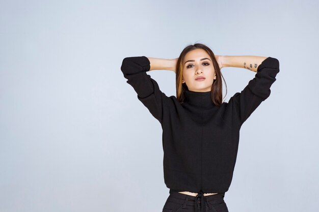 Girl in black shirt giving appealing and neutral poses. High quality photo