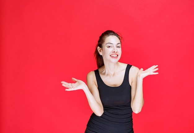 Girl in black shirt giving seductive and appealing poses. High quality photo