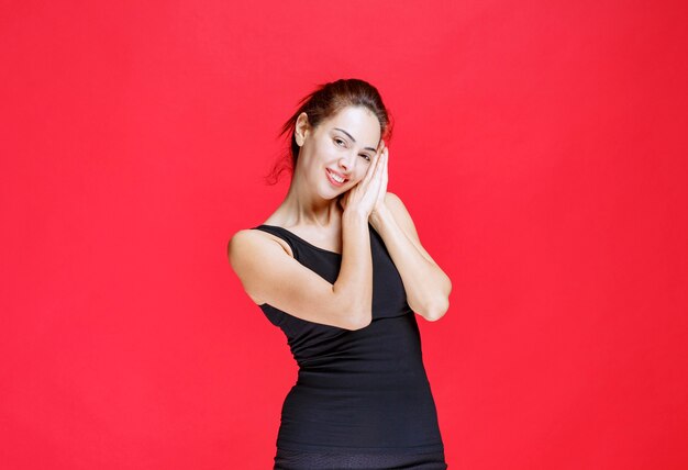 Girl in black shirt is tired and sleepy. High quality photo