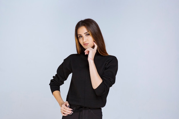 Girl in black shirt thinking and analizing. High quality photo