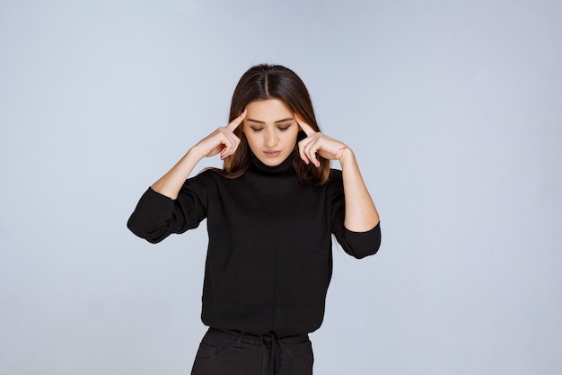 Girl in black shirt thinking and analizing. High quality photo