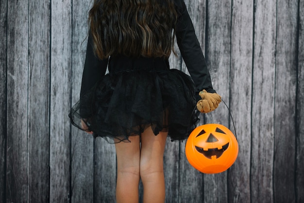 Free photo girl in black skirt holding basket