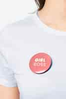 Free photo girl boss badge pin on a woman’s t-shirt close up