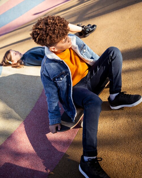 Girl and boy spending time together in the park