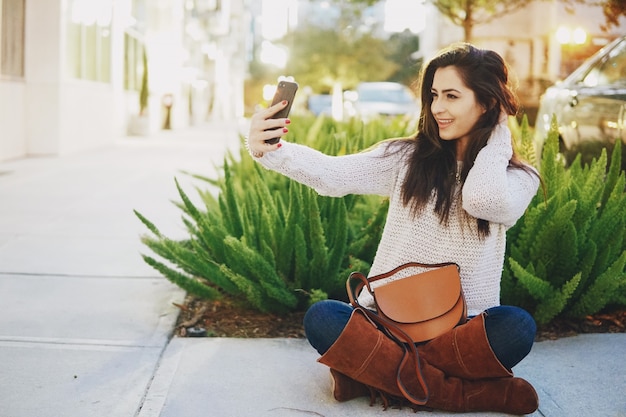 Girl brunette on the street on a warm evening