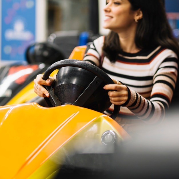 Free photo girl on bumper car