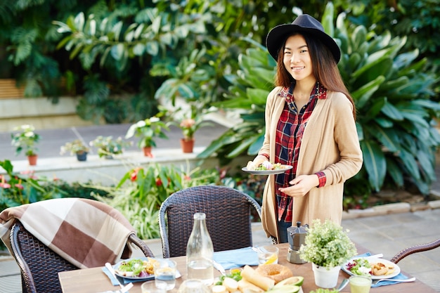 Free photo girl by served table