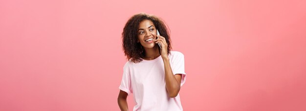 Free photo girl calling friend to meet up portrait of charming friendly and outgoing african american young