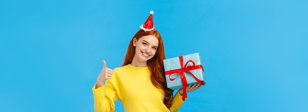 Free photo girl can wrap your gift easily pleased and assertive pretty redhead female shop assistant help out c