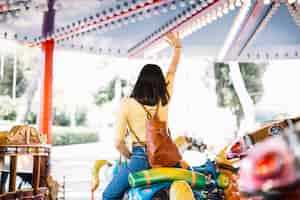 Free photo girl on a carrousel