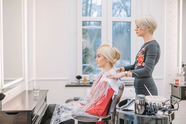 Girl in chair of professional hairdresser