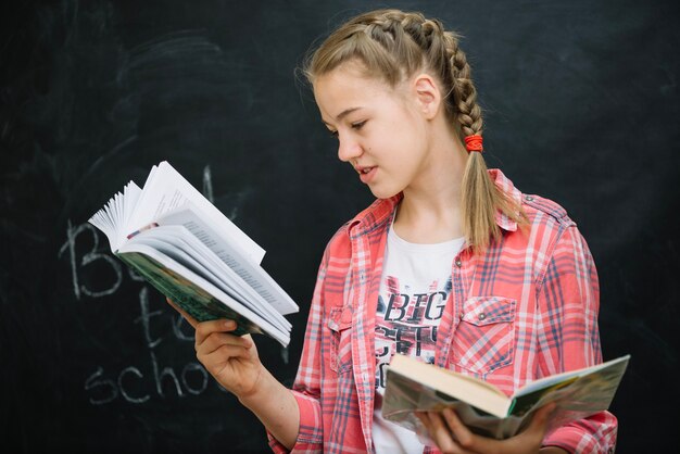 Girl in checkered shirt reading book