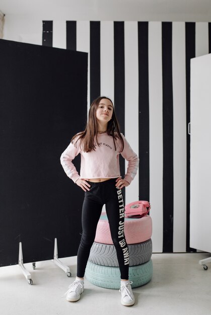 Girl child having fun and posing in studio