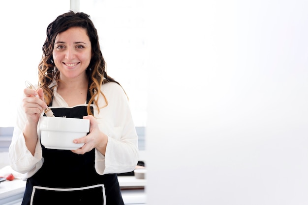 Free photo girl cooking in a bowl