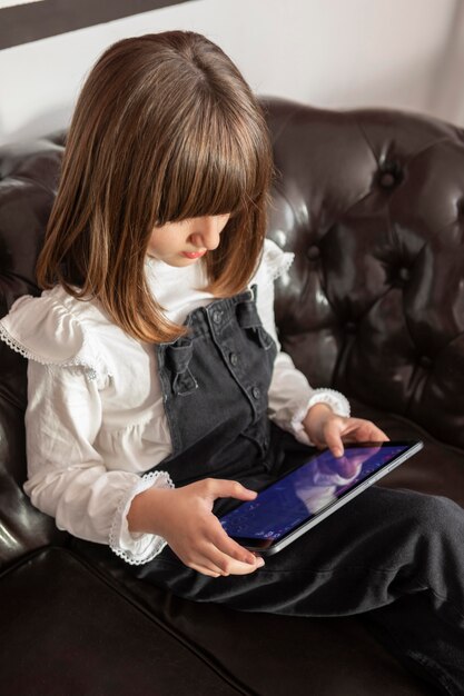 Girl on couch with tablet