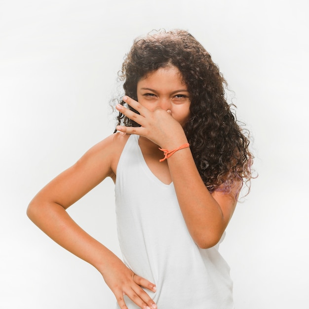 Free photo girl covering her nose due to unpleasant smell