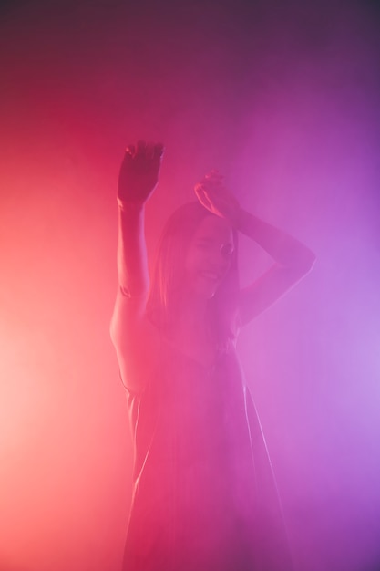 Free photo girl dancing in nightclub