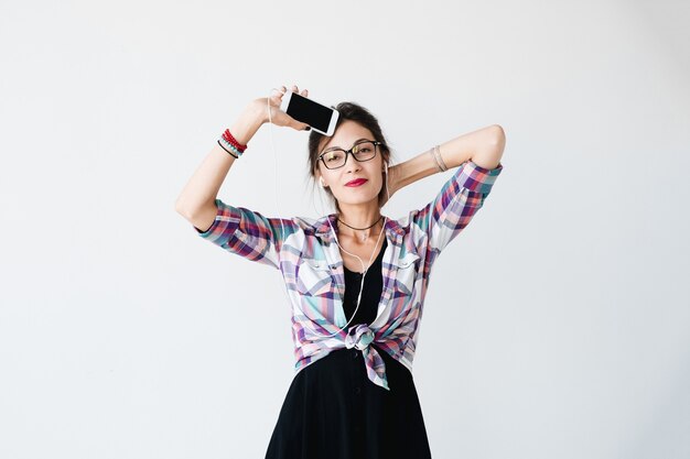 Girl dancing and showing the phone