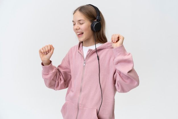 Girl dancing with headphones medium shot