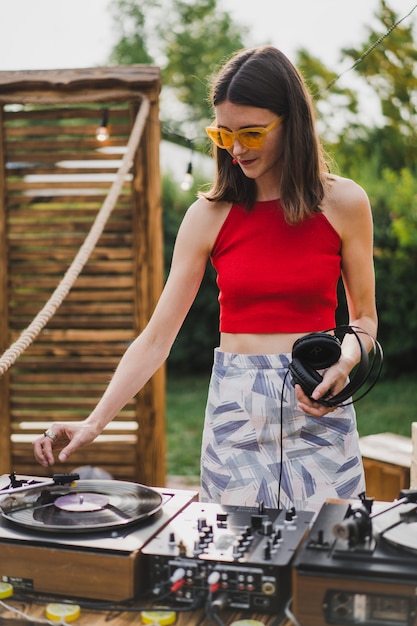 girl dj playing vinyl records