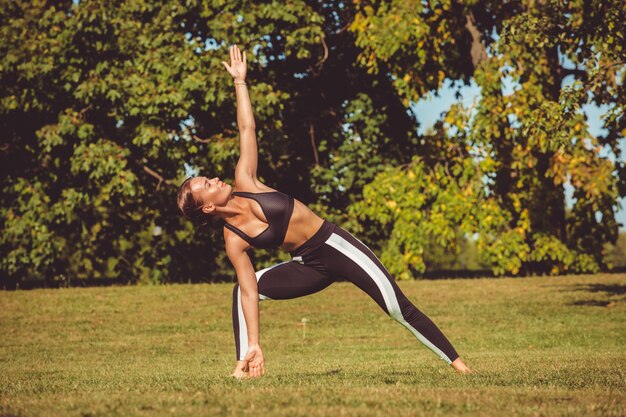 Girl doing exercise in the park