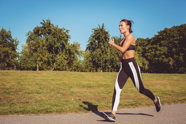 Girl doing exercise in the park