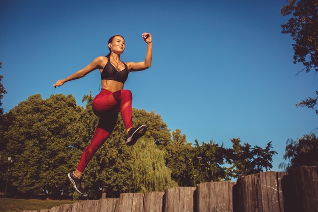 Girl doing exercise in the park