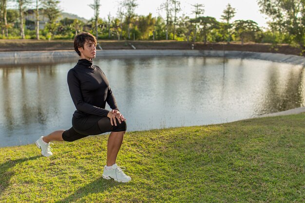 Girl doing warm-up in the park.