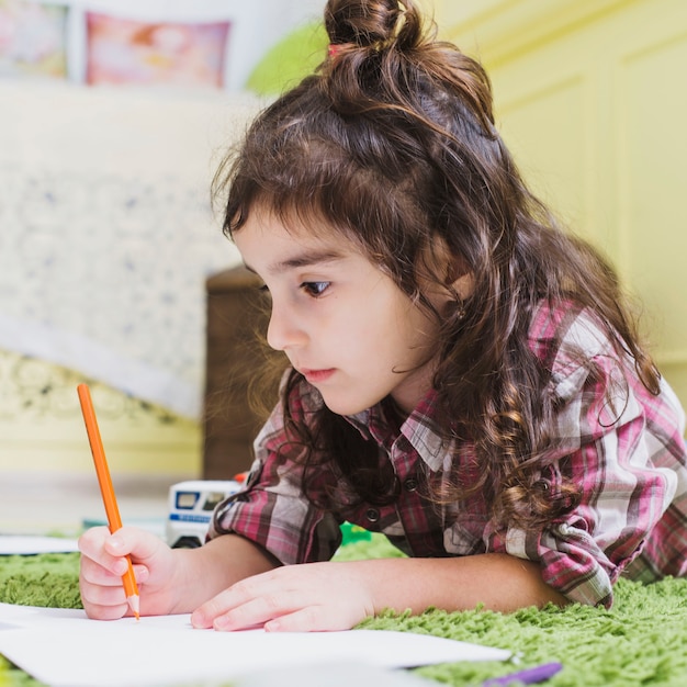 Girl drawing with pencil