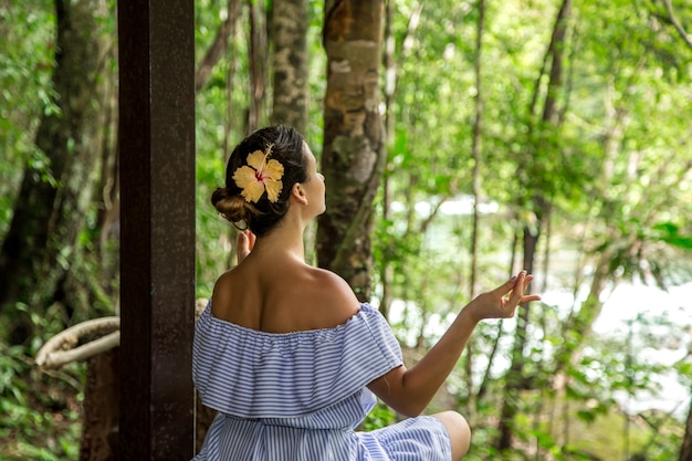 girl in a dress meditates