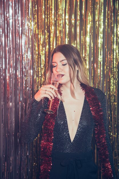 Girl drinking champagne at new year party