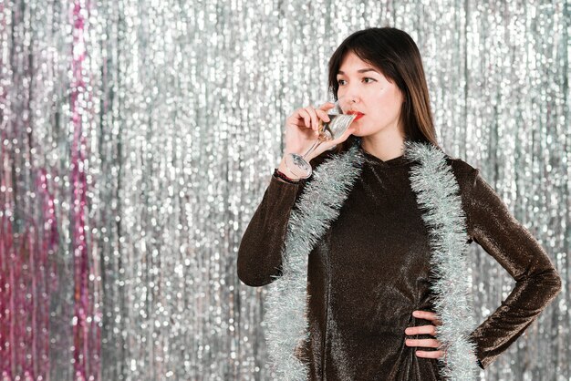 Girl drinking champagne in new year party