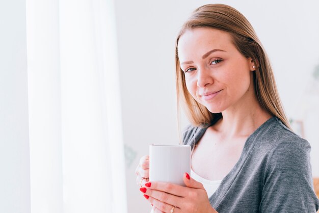 Girl drinking coffee in the morning