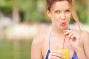 Free photo girl drinking through a straw