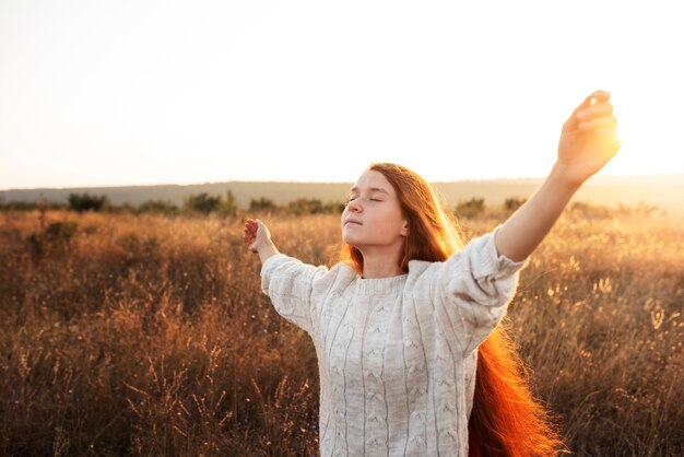 Girl enjoying freedom side view