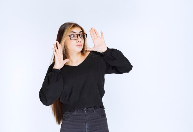 Girl in eyeglasses looks scared and terrified.