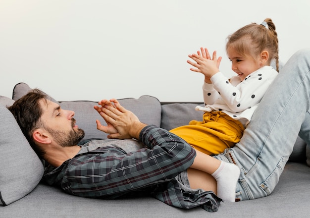 Girl and father at home having fun