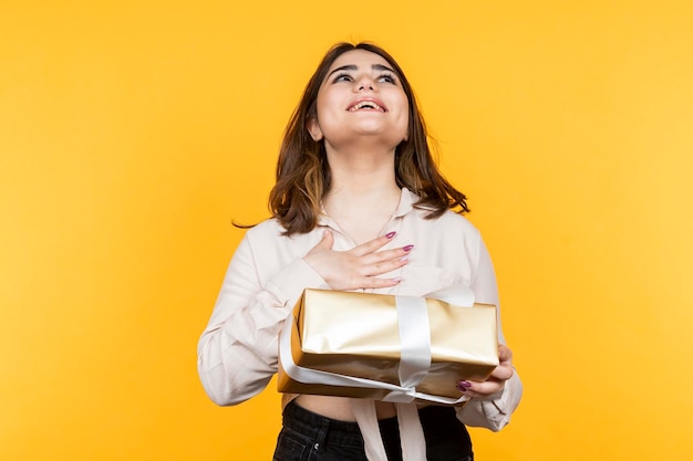 Girl feeling extremely happy because of the present High quality photo