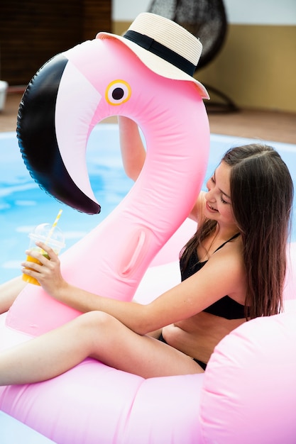 Girl and flamingo floatie with hat
