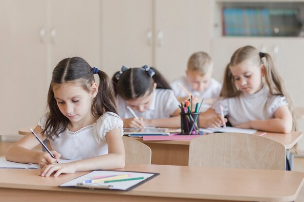 Girl fulfilling task at lesson