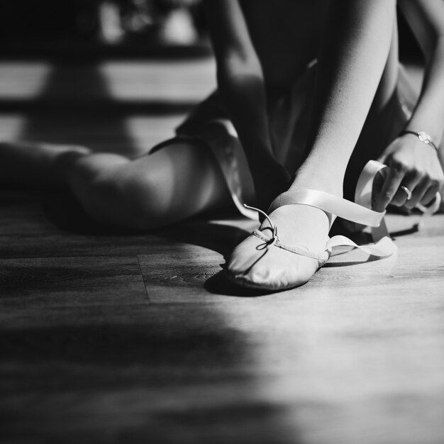 A girl getting ready to for a ballet lesson