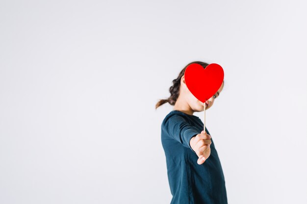 Girl giving heart