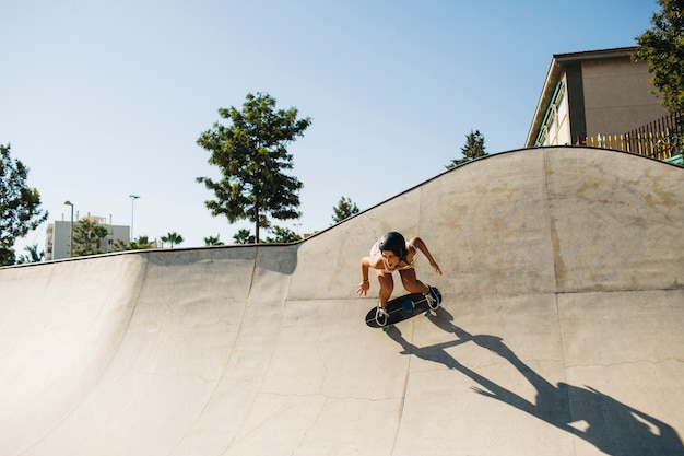 Girl going down the half pipe