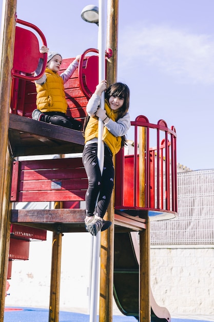 Girl going down pole