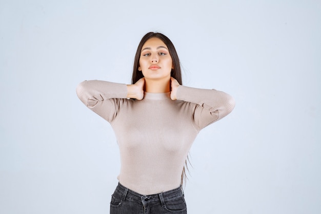 Girl in grey shirt giving positive and appealing poses. 
