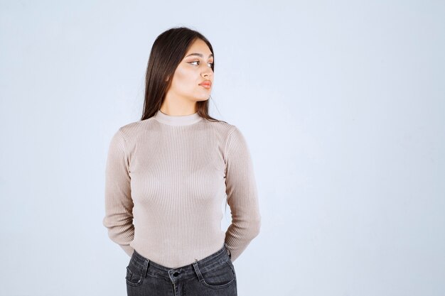 Girl in grey sweater giving nasty and seductive poses. 